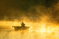 man fishes in the lakes of the Mazury